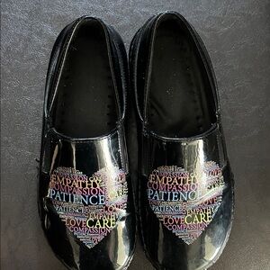 Women’s black with heart and sayings hospital shoe. Spring Step